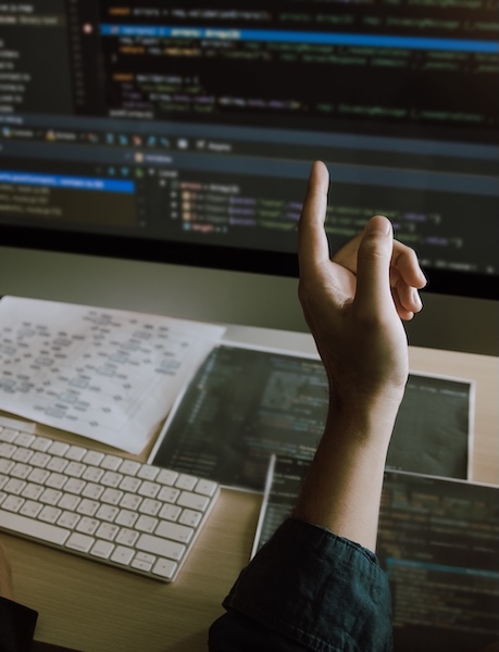 Photo of engineer analyzing code